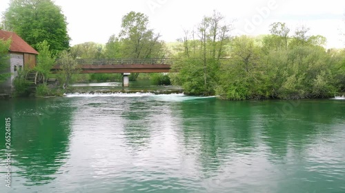 Croatia, road bridge over Mreznica river in Belavici village from drone, low flight over the water photo