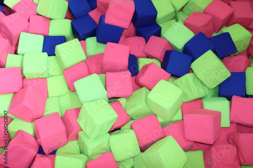 pool with colored toy cubes on baby playground