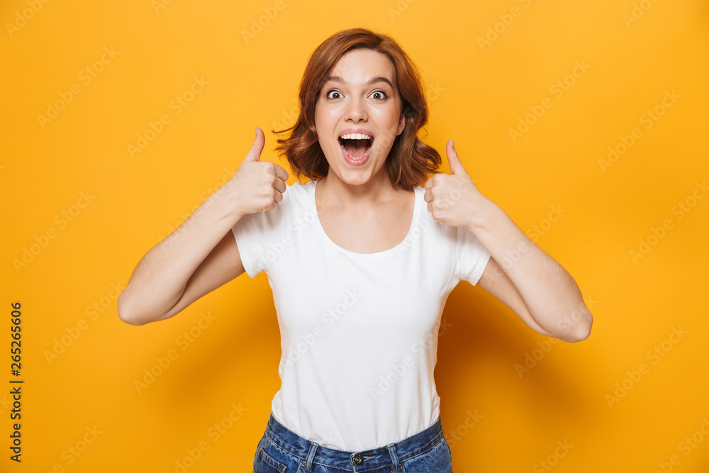 Cheerful young girl wearing t-shirt standing Cheerful young girl wearing t-shirt standing