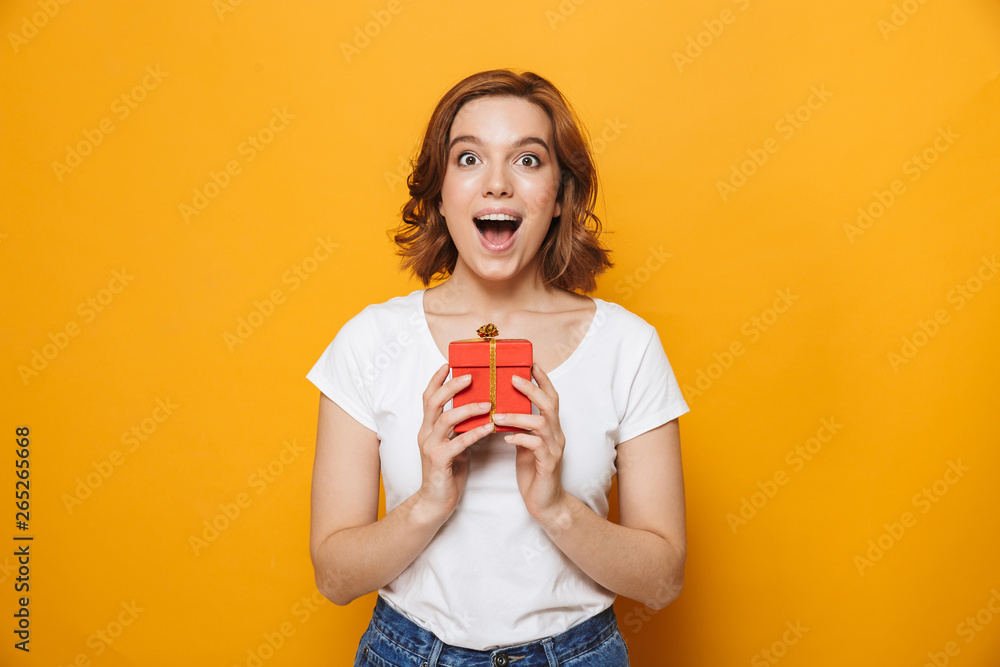 Cheerful young girl wearing t-shirt standing Cheerful young girl wearing t-shirt standing