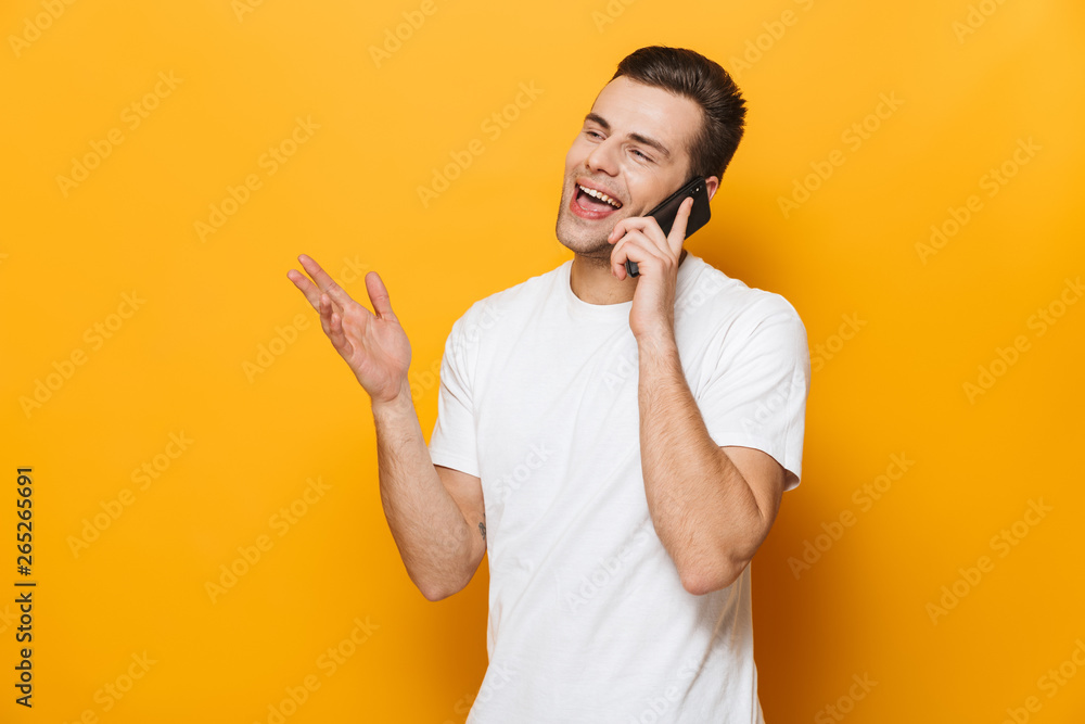 Portrait of a happy young man wearing t-shirt standing Portrait of a happy young man wearing t-shirt standing
