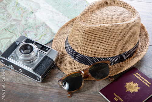 passports  map  summer hat and camera ready for holidays