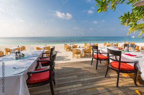 Beach restaurant with sea view  luxury tropical resort outdoor restaurant scene