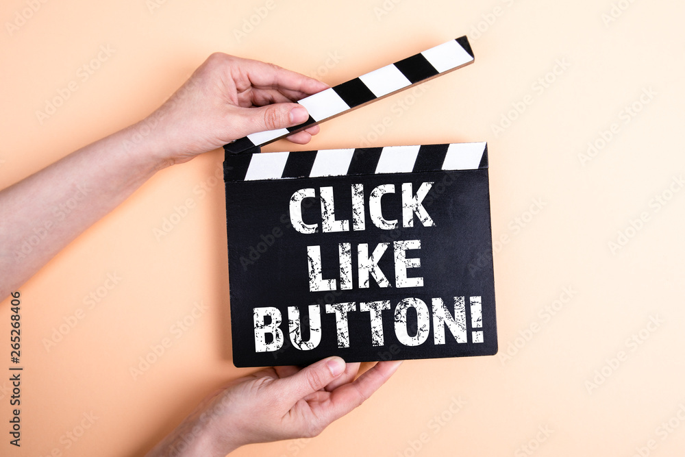Click like button. Female hands holding movie clapper
