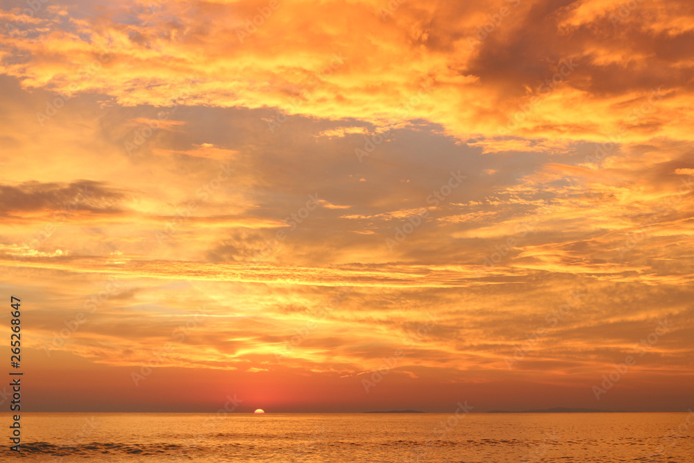 Sunset over the sea with islands at horizon Sunset over the sea with islands at horizon