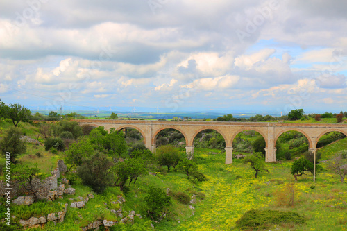 Railway bridge through the picturesque landscape of Apulia, Italy