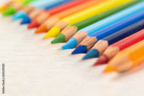 Set of colored pencils. Colors of rainbow. Colored pencils for drawing different colors on a light background.