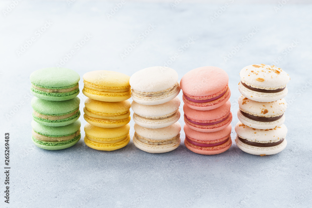 Stacks of colorful macarons with various fillings. Stacks of colorful macarons with various fillings.