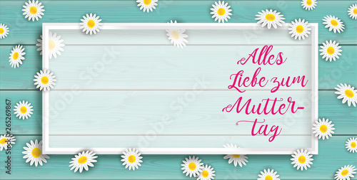 Alles Liebe zum Muttertag Rahmen mit Blüten auf türkisfarbenem Holzhintergrund