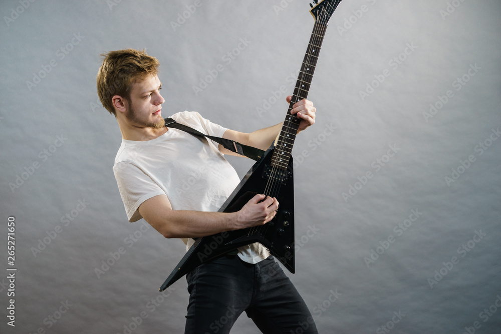 Fototapeta premium Man playing on electric guitar