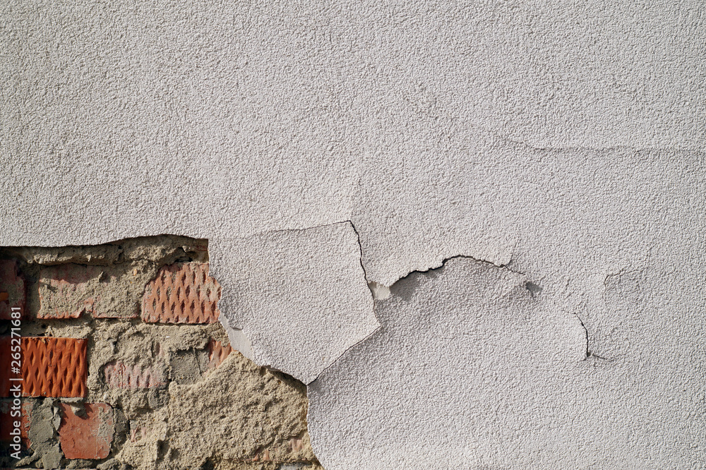 Damaged plaster wall background.