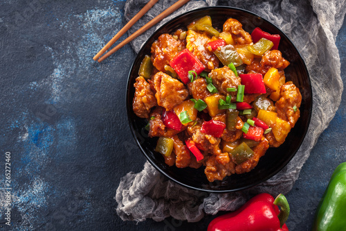Murais de parede Sweet and sour chicken with colorful bell pepper on a plate