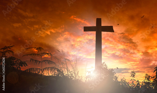 Silhouette the cross on sunset background