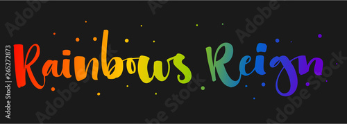 Rainbows Reign. Gay Pride rainbow colors modern calligraphy text quote on dark background background