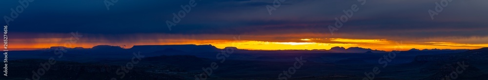 Stormy sunrise with mountain silhouette