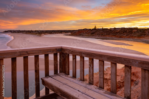 A beautiful sunrise at southport port noarlunga south australia overlooking the wooden staircase ocean and cliffs on the 30th April 2019