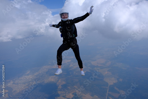Girl in leather jacket is flying in the amazing sky.