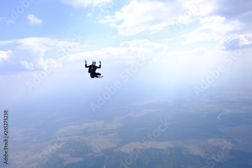 Fototapeta Naklejka Na Ścianę i Meble -  Girl in leather jacket is flying in the amazing sky.