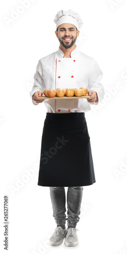Chef with fresh buns on whi...