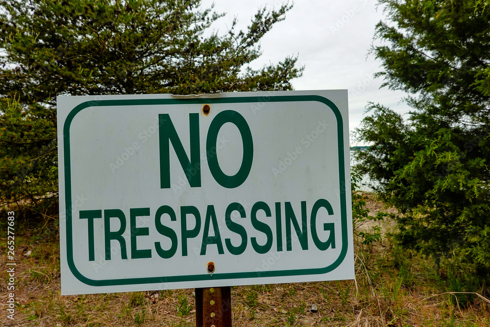 Solomons, Maryland, USA A no trepassing sign on the beach Solomons, Maryland, USA A no trepassing sign on the beach