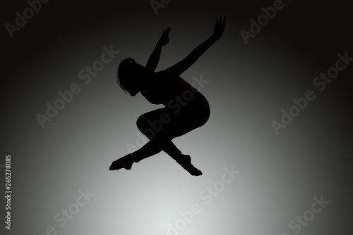 athletic jumping girl studio shot © Alex Shadrin