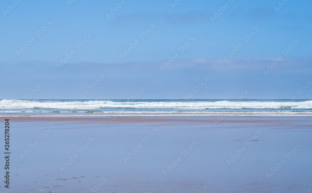 Wet sand of Mawgan Porth beach, Cornwall, UK