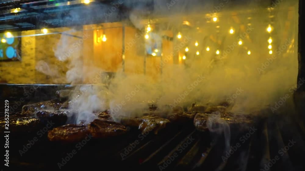 grilling steak on barbecue, close up grilling steak on barbecue, close up