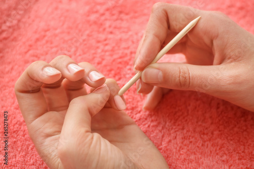 Woman doing manicure  closeup