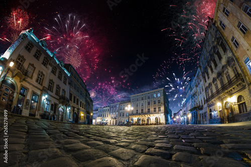 Festival celebration City background with Fireworks. Empty night plaza, old architecture. © Anna Stakhiv