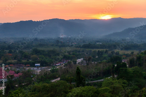 view of the river and mountains on Khun Dan Prakan Chon dam is largest and longest roller compacted concrete dam in the world during sunset  in Nakonnarok province Thailand.