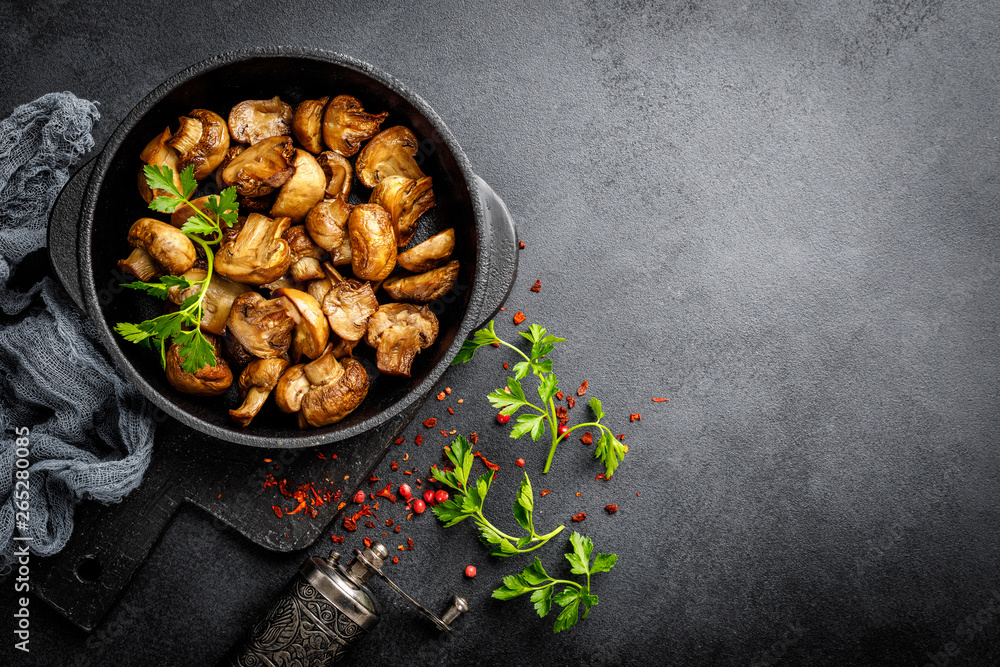 Fried mushrooms, champignons in pan