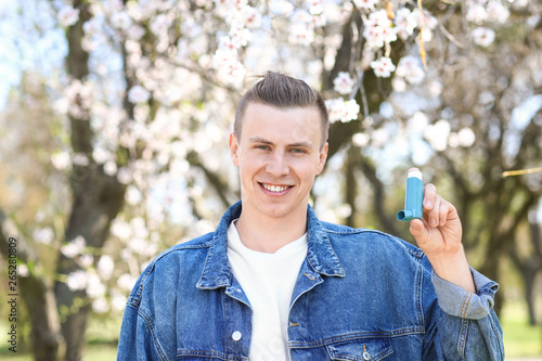 Man with inhaler on spring day