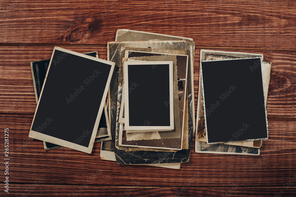 retro some old photos on wooden table retro some old photos on wooden table