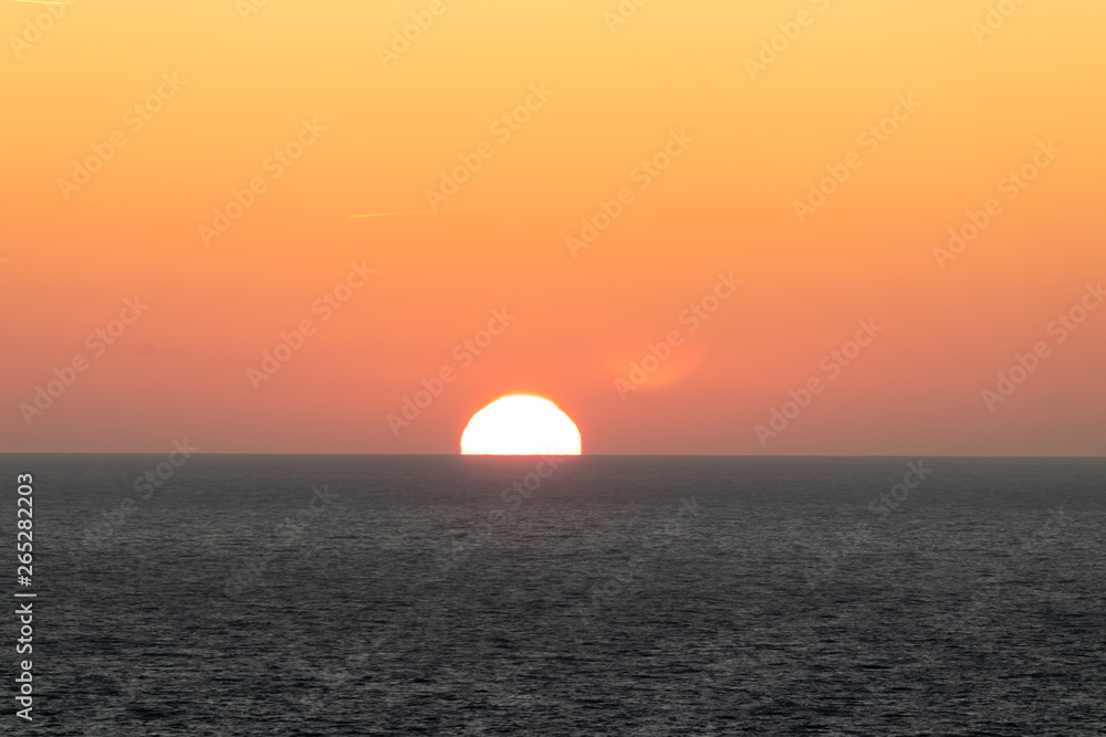 Sun on horizon over the Irish sea.