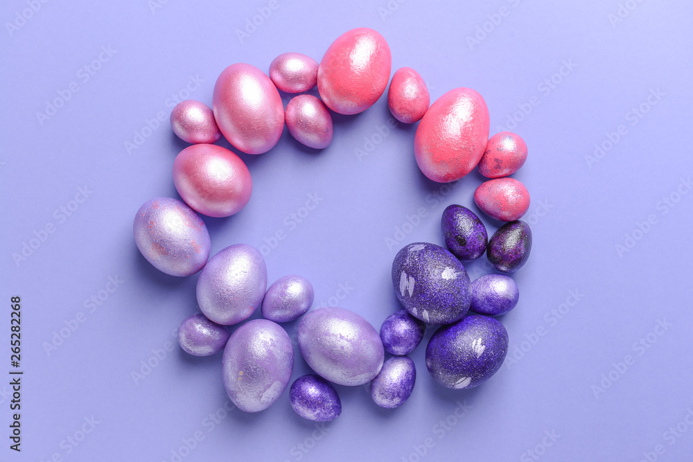 Frame made of beautiful Easter eggs on color background Frame made of beautiful Easter eggs on color background