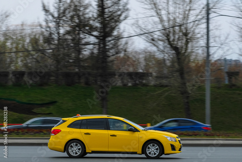 Moscow, Russia - April, 27, 2019: image of yellow taxi on Moscow street in Moscow © Dmitry Vereshchagin