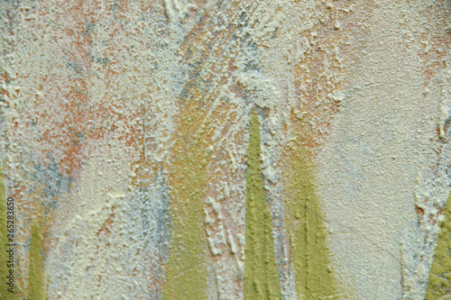 Blurred abstract background. The texture of a painted concrete rough surface with cracks and coarse strokes of lime color. Cropped shot, horizontal, place for text, nobody. Design concept.