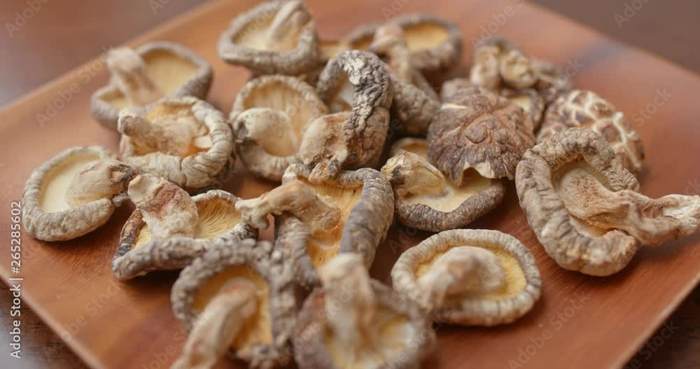 Dry of the mushroom on wooden plate Dry of the mushroom on wooden plate