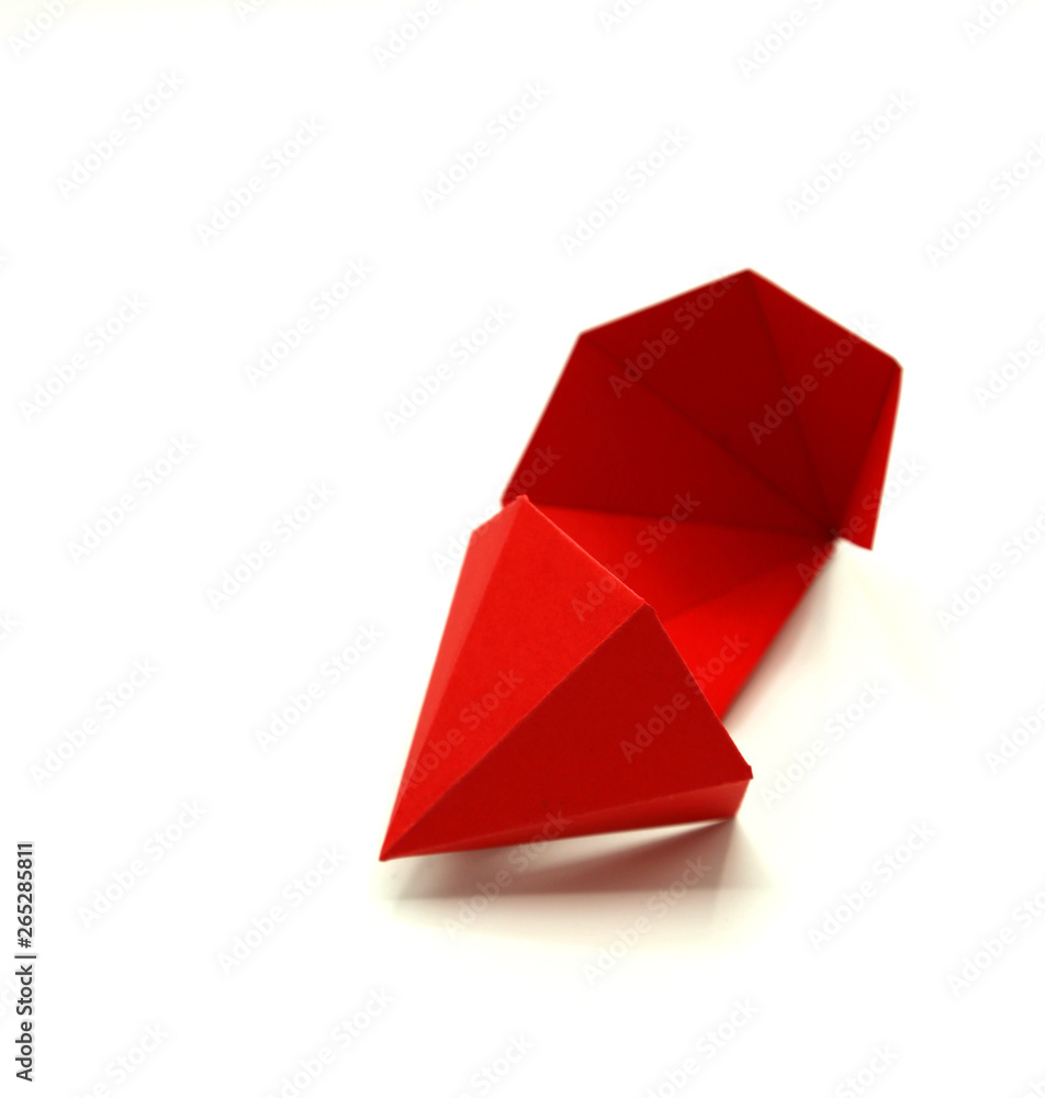 Geometric shape cut out of paper and photographed on white background. Geometry net of Hexagonal Dipyramid. 2-dimensional shape that can be folded to form a 3-dimensional shape or a solid. Geometric shape cut out of paper and photographed on white background. Geometry net of Hexagonal Dipyramid. 2-dimensional shape that can be folded to form a 3-dimensional shape or a solid.