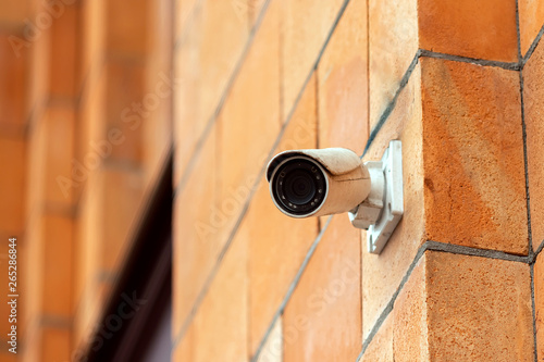 Video camera security system on the wall of the building. The concept of video surveillance, surveillance.