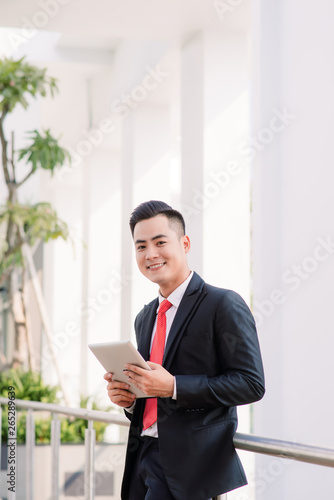 Young Asian Businessman working on table