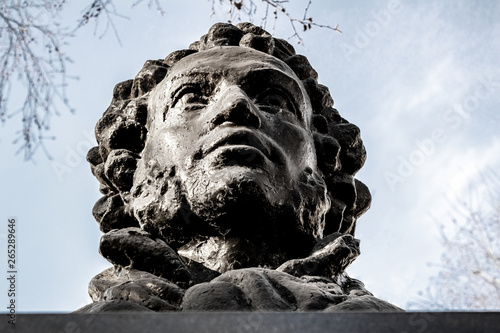 UFA, RUSSIA - 11 APRIL 2019: close-up bust of the Alexandr Sergeevich Pushkin against the sky, greatest russian poet, editorial photo photo