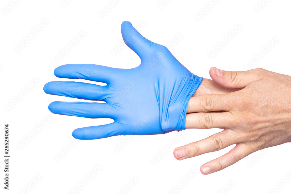 Doctor taking off her blue medical gloves. White background