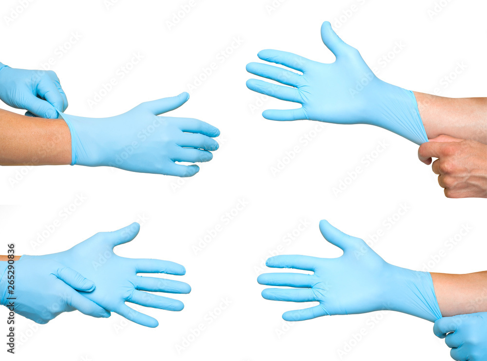 Doctor putting on protective blue gloves isolated on yellow background