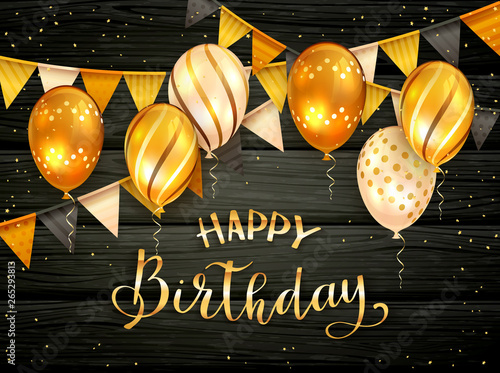 Golden Birthday Balloons and Pennants on Black Wooden Background