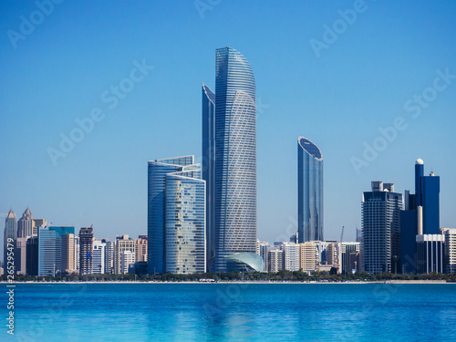 Blue sea at marina island with modern Abu Dhabi skyline cityscape © PixHound