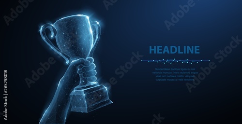 Hand with Trophy cup. Abstract vector 3d trophy isolated on blue background. Champions award, sport victory concept. photo
