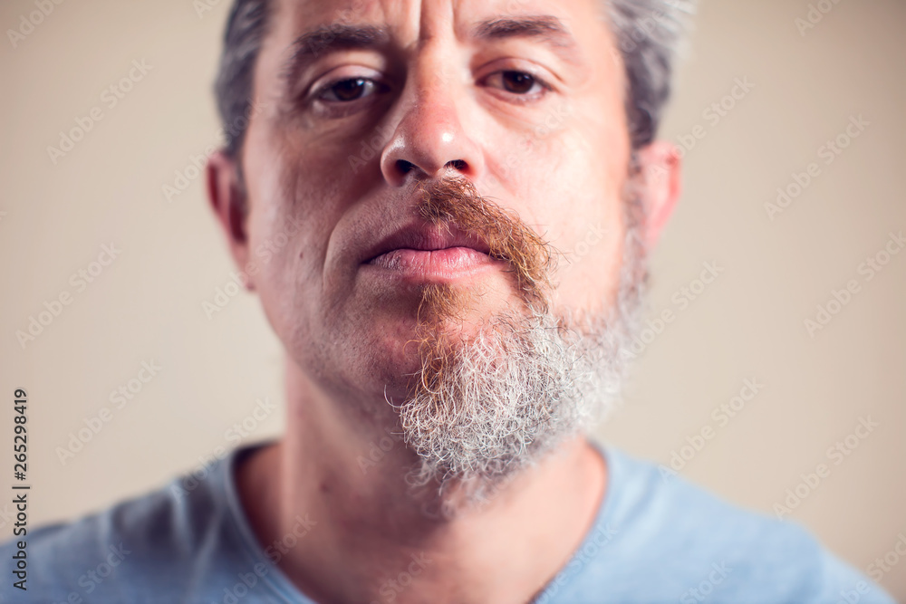 Obraz premium A portrait of man with half beard and hair