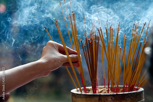 Emperor Jade pagoda (Chua Phuoc Hai), incense sticks on joss stick pot burning, smoke used to pay respect to the Buddha, Ho Chi Minh City, Vietnam photo