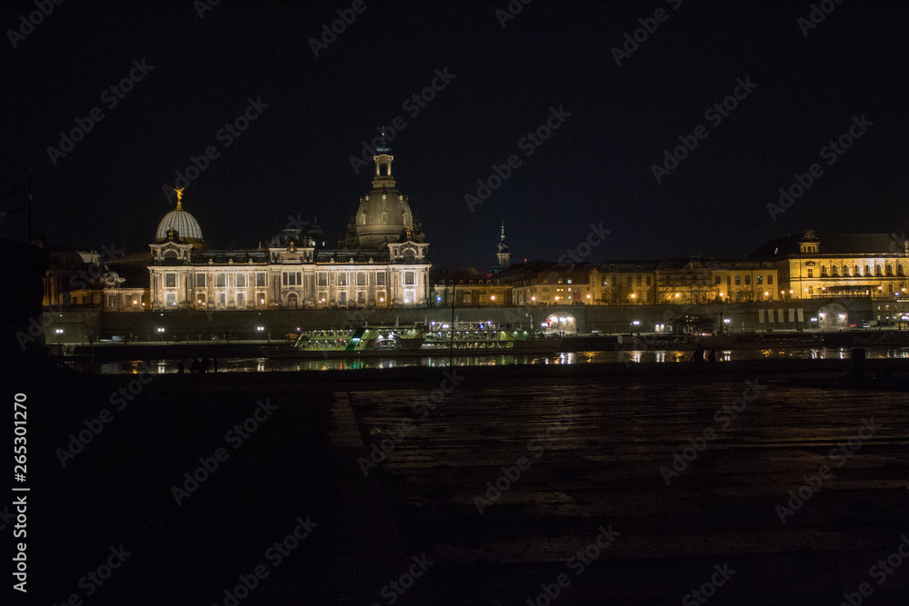 Streets and lights, reflection and shine of the night city of Dresden, Germany.